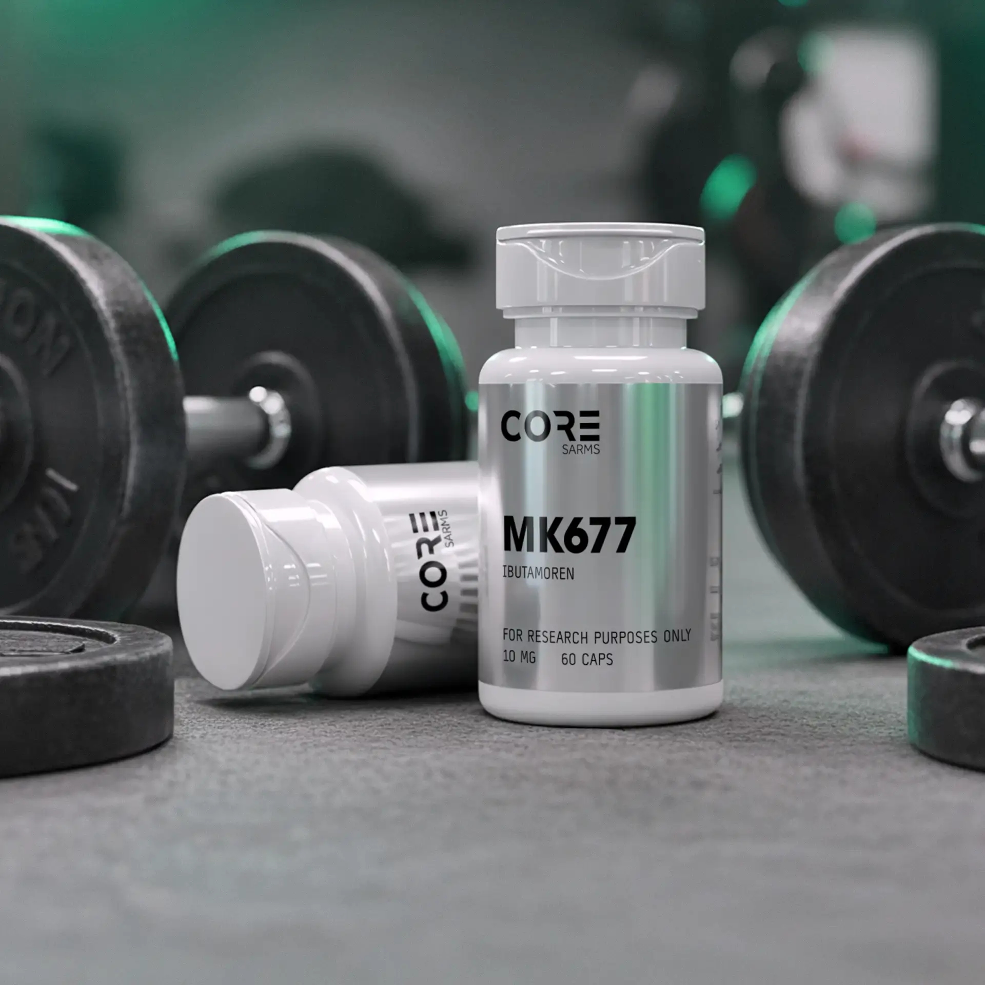 CORE SARMS MK677 Ibutamoren 10mg bottles displayed in a gym setting next to dumbbells, 60 capsules per bottle